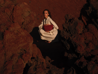 Leather Raspberry clutch with shoulder strap, handmade in Spain. La Portegna