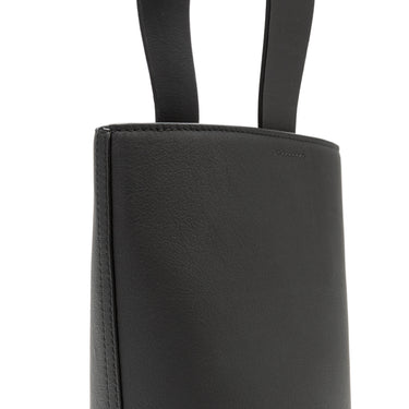 bolso tipo bucket de piel negro hecho a mano con detalle de nudo, asa superior y bandolera