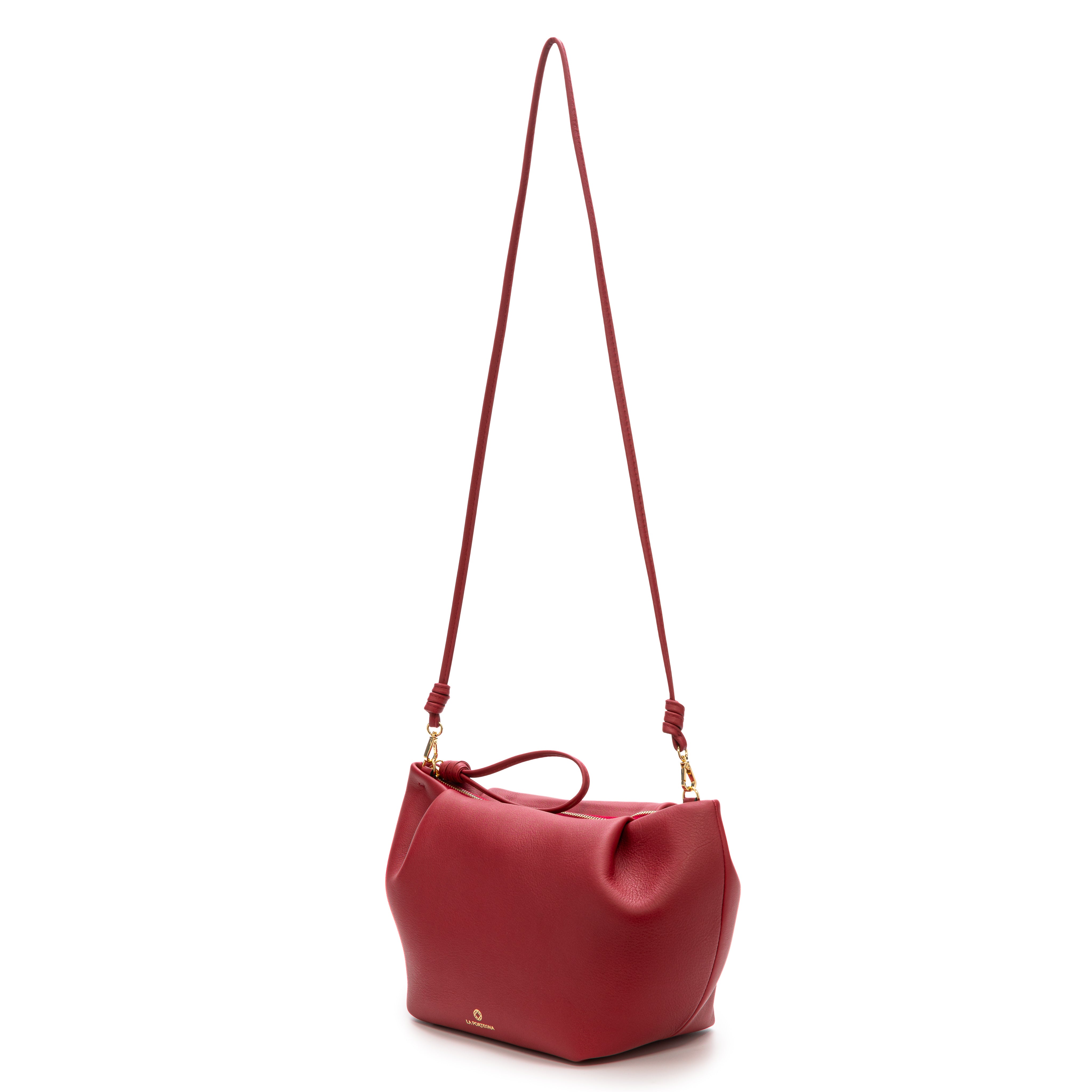 Leather Raspberry clutch with shoulder strap, handmade in Spain. La Portegna